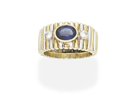 SAPPHIRE AND DIAMOND RINGBicoloured, the oval-cut sapphire, between brilliant-cut diamonds, ring size approx. OFor further in