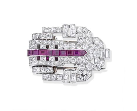 RUBY AND DIAMOND CLIP BROOCH, CIRCA 1930Of openwork geometric design, set throughout with old brilliant, single, baguette and