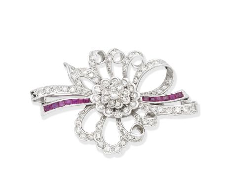DIAMOND AND RUBY BROOCHThe flowerhead centre, surrounded by ribbons, set with brilliant and single-cut diamonds and accented 