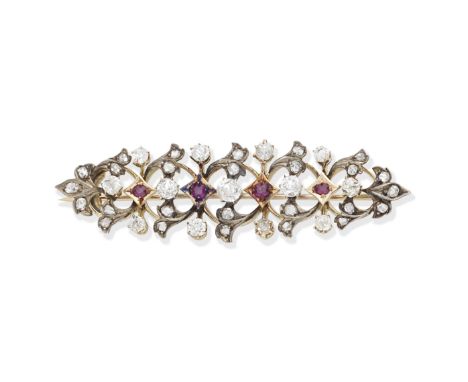 RUBY AND DIAMOND BROOCH, CIRCA 1900Of scrolling foliate design, set throughout with old brilliant and rose-cut diamonds and c