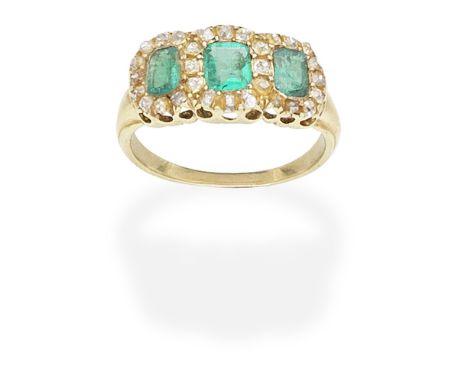 EMERALD AND DIAMOND RINGThe three graduating step-cut emeralds set within surrounds of old cushion-shaped diamonds,   ring si