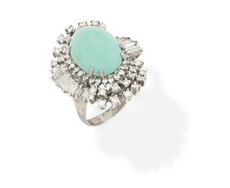 TURQUOISE AND DIAMOND CLUSTER RINGThe turquoise cabochon within an undulating surround of brilliant, single and baguette-cut 