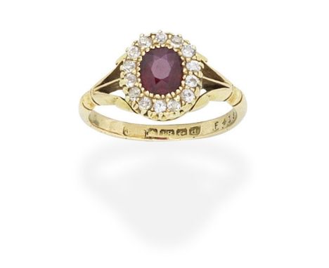 RUBY AND DIAMOND CLUSTER RING,  1903The cushion-shaped ruby within a surround of similarly-shaped diamonds, between trifurcat