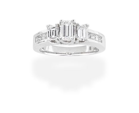 DIAMOND THREE-STONE RINGSet with three step-cut diamonds, between princess cut diamond shoulders, diamonds approx. 1.40cts to