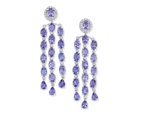 TANZANITE AND DIAMOND PENDENT EARRINGS, 2019Each oval-cut tanzanite within a brilliant-cut diamond surround, suspending three