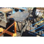 Metal rubber topped work bench.