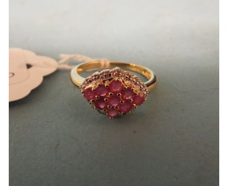 A 9ct yellow gold, ruby and diamond cluster ring