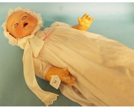 An Armand Marseille bisque head doll, with moulded hair and sleeping blue eyes, impressed A M/Germany/351./8.K, on a composit