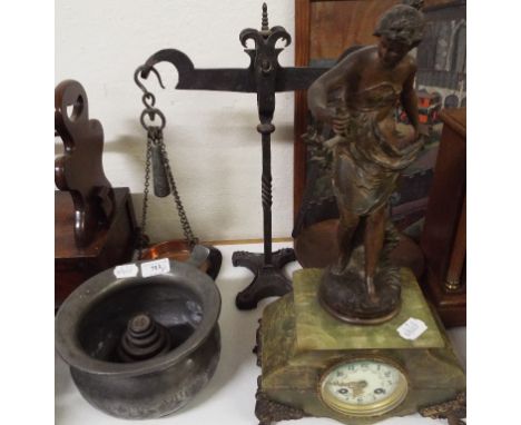 An amusing pewter chamber pot, a mantel clock, in a spelter figural and green onyx case, and a set of scales and weights