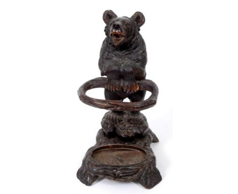 An early 20th century Black Forest style carved wood bear stick stand, 73 cm high  See illustration Condition report Report b