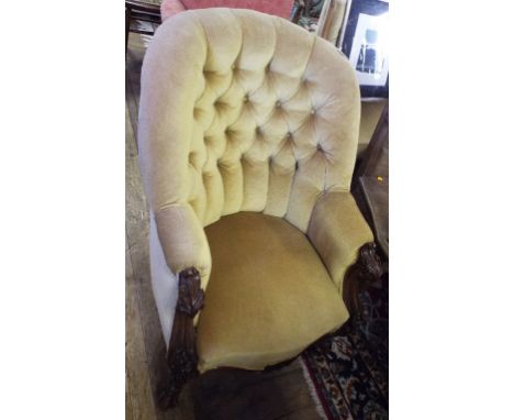 A Victorian carved walnut button back armchair, on cabriole front legs