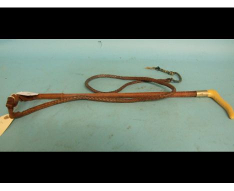 A lady's hunting crop, with a plaited shaft, fitted a thong, 55 cm long