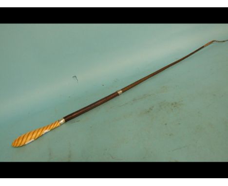 A riding whip, with a leather handle and silver coloured metal mounts, with an ivory finial of twist form, 83 cm long