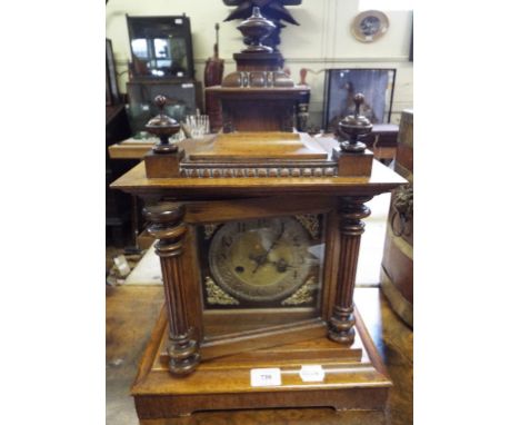 A German mantel clock, in an oak case, 44 cm high