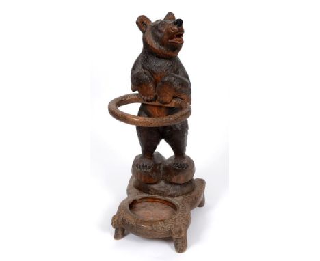 An early 20th century Black Forest style carved wood bear stick stand, 85 cm high  See illustration Condition report Report b