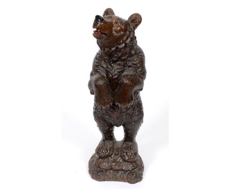 An early 20th century Black Forest carved wood standing bear (probably a stick stand originally), 84 cm high  See illustratio