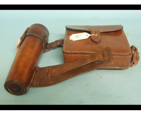 An early 20th century leather cased hunting canteen, containing a plated sandwich box and a glass flask, with plated mounts, 