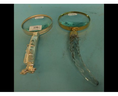 A novelty magnifying glass, the handle in the form of a golf caddy, and another (2)