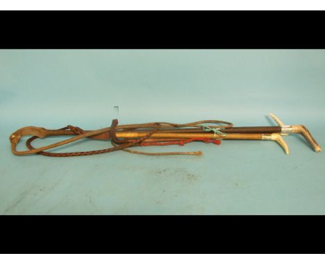 A silver coloured metal mounted hunting whip, crested and inscribed 1877, with a horn handle, plaited shaft and a thong, and 