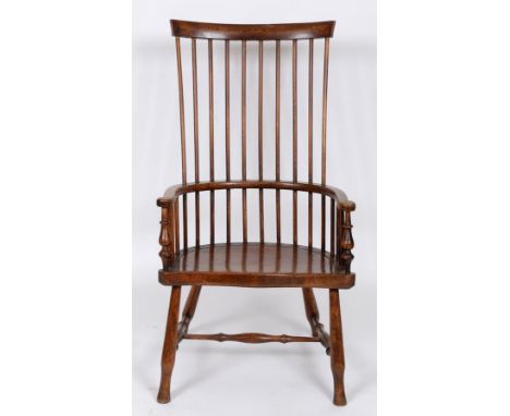 A 19th century stick back kitchen armchair  See illustration