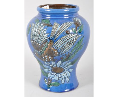 A C H Brannam Art pottery blue ground baluster vase, 20th century, impressed marks, incised with a stylised long tailed bird 