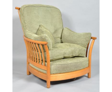 An Ercol Renaissance Golden Dawn armchair, with high back, a bentwood curved top rail and stick back sides, the drop-in cushi