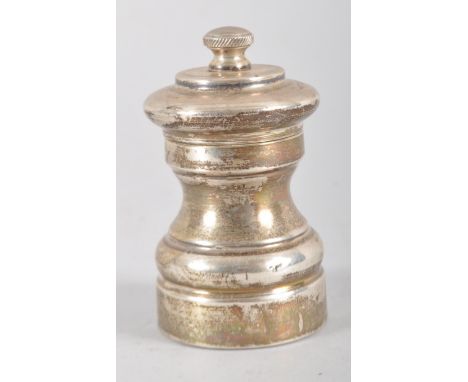 A silver pepper grinder, London 1976 (maker Da-Mar Silverware), 8cm high