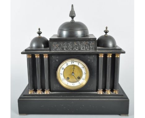 A Victorian slate mantel clock, the white chapter ring with Arabic numerals, the movement striking on a gong, the base of arc