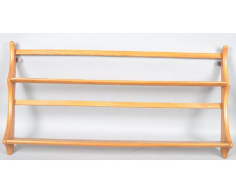 Lucian Ecrolani - Ercol - A 1960's retro vintage beech and elm wall mounted plate rack in the blonde colourway, 49.5cm high, 