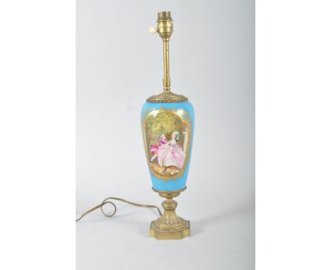 A gilt metal mounted Sevres style lamp base, circa 1900, the oviform vase painted with an 18th century style couple in garden