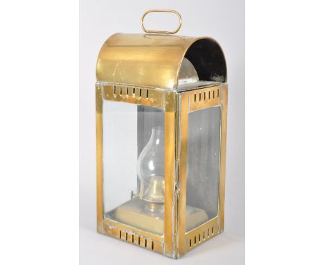 A 19th century brass carriage lantern, with arched top, glazed door and sides, with removable oil lamp, 344.5cm high