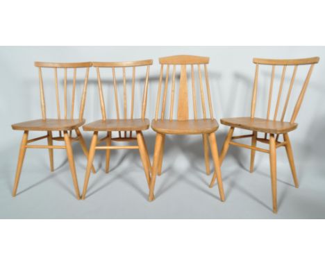 Three Ercol pale elm and beech stick back dining chairs, and another similar, with curved top rail on tapering splayed legs, 