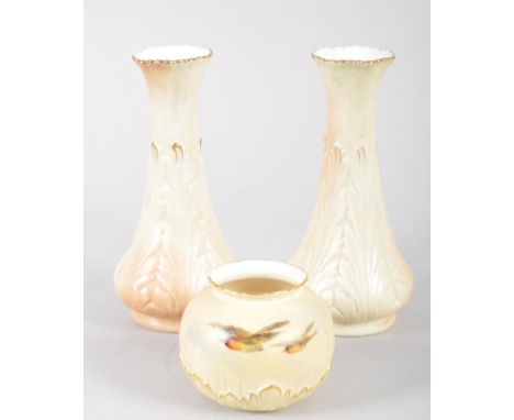 A Royal Worcester globular blush ivory ground vase, painted with robins in flight,17cm high, and a pair of Locke &amp; Co blu
