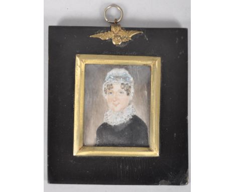 19th century School, a portrait miniature of an elderly lady in lace bonnet and ruff, watercolour on ivory, in rectangular eb