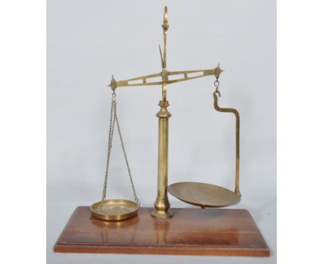 A pair of late 19th century brass scales, on mahogany plinth base, 53cm high