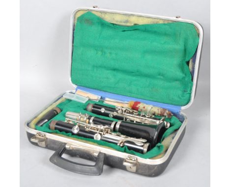 A Boosey and Hawkes Regent clarinet, in case with two mouth pieces