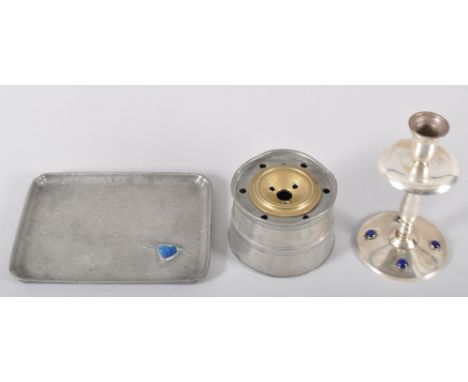 An Art Nouveau pewter tray, inset a Ruskin type ceramic roundel, 21.5cm wide, a silvered brass candlestick with glass cabocho