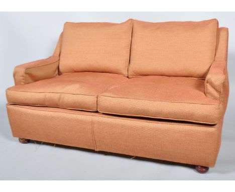 A Dodge &amp; Son (Sherborne) contemporary two seater sofa, with tall upright back, with drop in cushions, upholstered in red