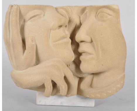 A Contemporary carved sandstone sculpture, incised AS (verso), carved with double portrait of two heads in an embrace, on a m