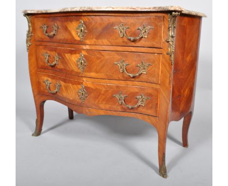 A French Louis XV style Kingwood marble topped ormolu mounted bombe commode, mid 19th century, of serpentine outline with a r