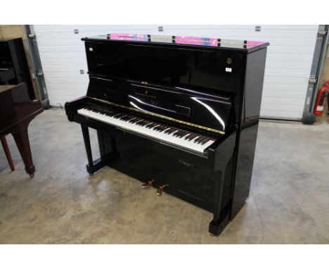 Steinway (c2017) A Model K upright piano in a bright ebonised case.&nbsp;AMENDMENT Is fitted with a Quiet Time system.