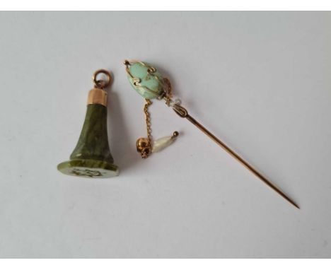 A gold mounted turquoise stick pin and fob seal 