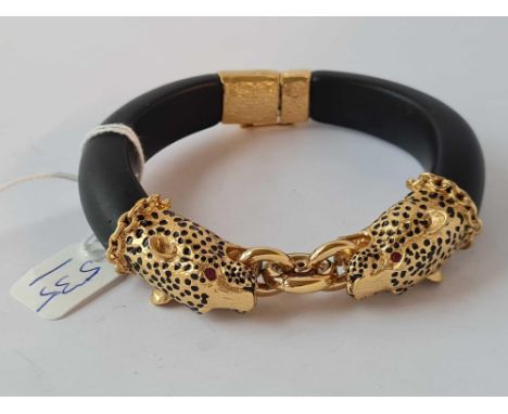 A gilt metal bangle 