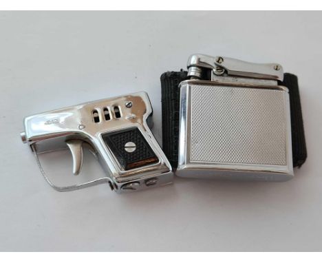 A ""PEACE"" lighter in the form of a starting pistol together with a CALIBRI monopol empire lighter in pouch 