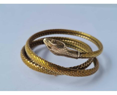 An impressive vintage metal coiled snake bracelet