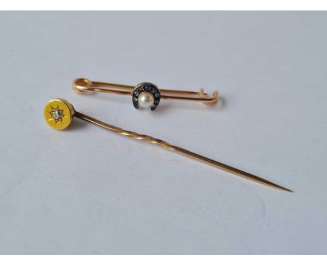 A pearl and diamond horse shoe brooch and gold topped diamond stick pin 