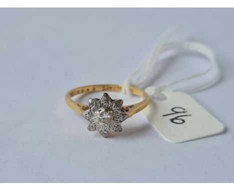 A diamond solitaire ring in star shaped mount 18ct gold size o - 3 gms 