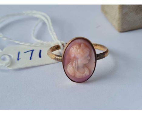 A gold cameo ring marked “shell cameo” in vintage box