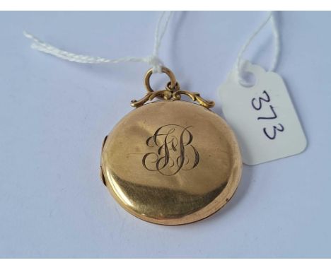 A circular 9ct vintage locket 4.7g inc