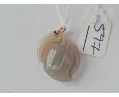 A polished jade pendant 
